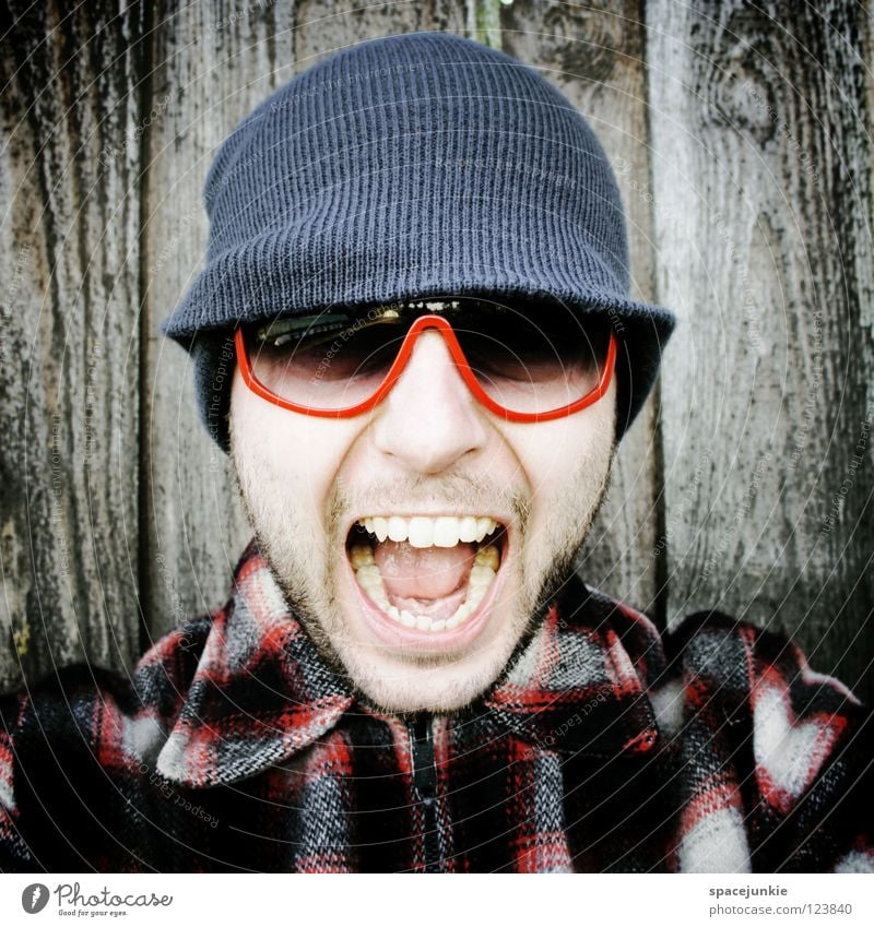 Rock it! (2) Man Portrait photograph Freak Scare Wall (building) Wood Eyeglasses Sunglasses Cap Winter Cold Freeze The eighties Easygoing Whimsical Humor Joy