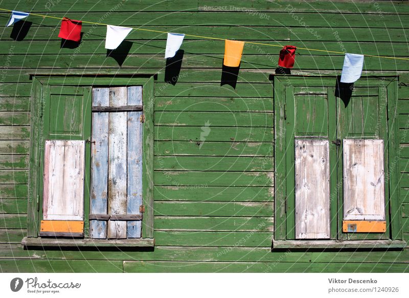 Green wall of an old house with a window and choked flags Beautiful Vacation & Travel House (Residential Structure) Sky Village Town Building Architecture