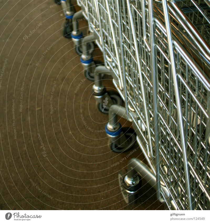 shop 'til you drop! Shopping Trolley Metal Green Supermarket Wall (building) Consumption Containers and vessels Structures and shapes Wheel Deserted