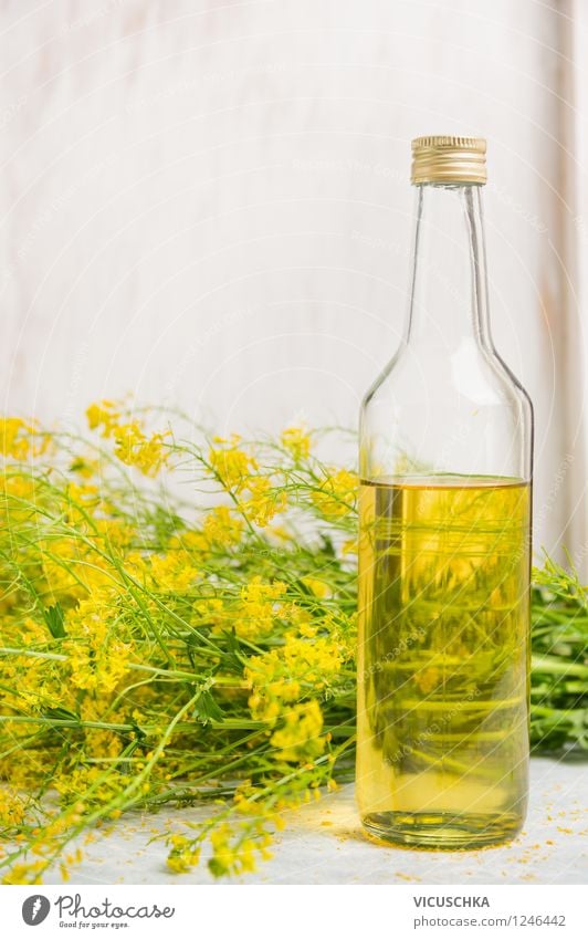 Glass bottle with rapeseed oil Food Cooking oil Organic produce Vegetarian diet Diet Bottle Style Design Healthy Eating Life Nature Plant Leaf Blossom