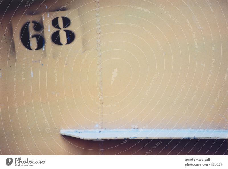 [68] Digits and numbers Wall (building) House (Residential Structure) Black Beige Leipzig South Detail Colour two-digit Wooden board suburban south Analog color