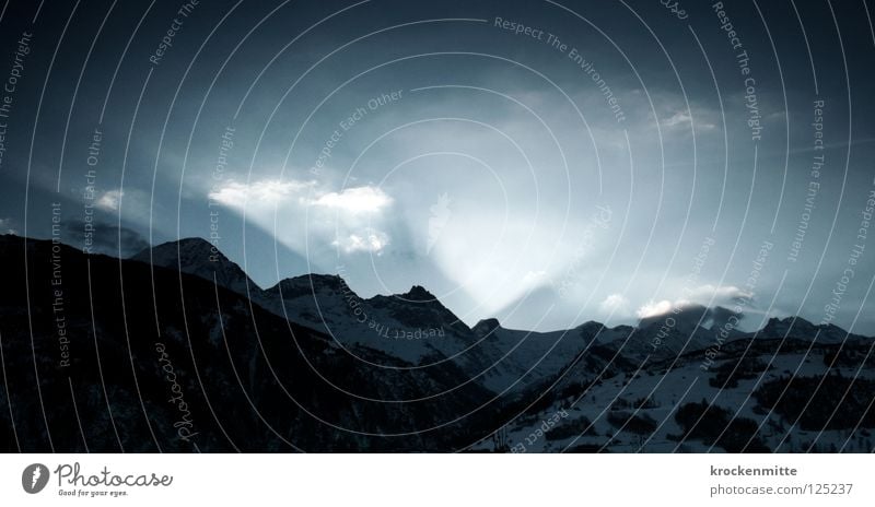 The beginning Light Mountain range Morning Sunbeam Back-light Switzerland Canton Graubünden Clouds Wake up Beginning Sunrise Hill Radiation Dawn Mountain ridge