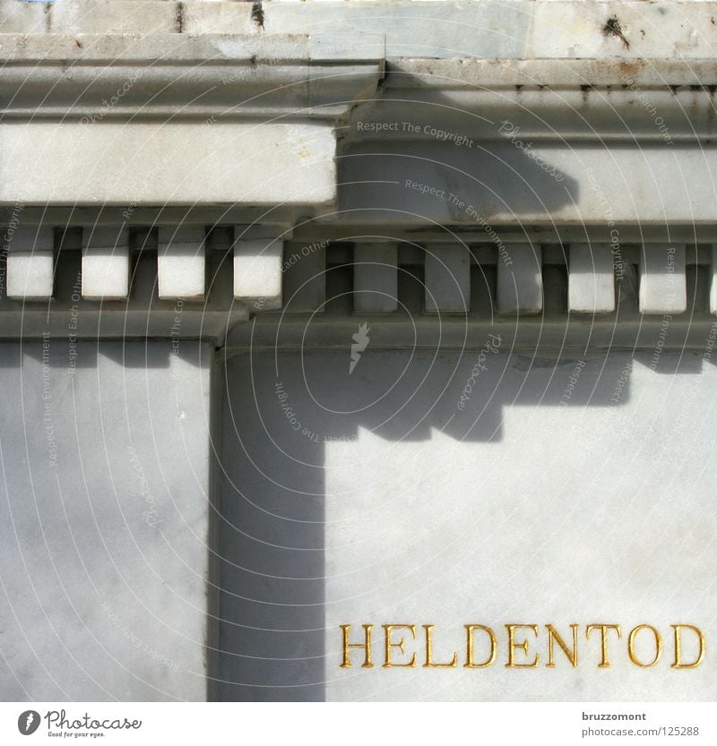 helmet on Monument Tombstone Wall (barrier) Calm War Light Dignity Honor Inscription Landmark Death Sacrifice honorable death Gold Marble Stone Peace Shadow