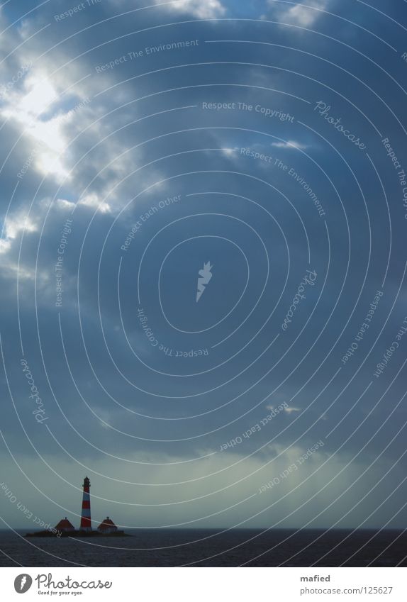 The Blanke Hans Gale Lighthouse Waves Clouds Flood Westerhever Dike North Frisland Ocean North Sea murder lake Emma Water Sky Sun Wind High tide pitched