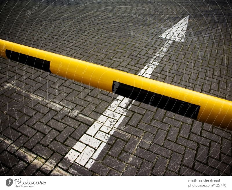 LOCKED UP. Asphalt Concrete Hard Cold Black Tar Stripe White Ground markings Hold Stop Sunlight Ghetto Old Transport Control barrier Cross Yellow Pave Direction