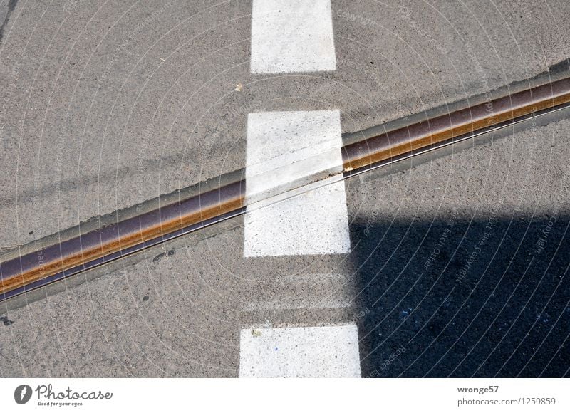 Halberstädter Street Traffic infrastructure Road junction Railroad tracks Signs and labeling Line Stripe Town Brown Gray Black White Pavement Marker line Lined