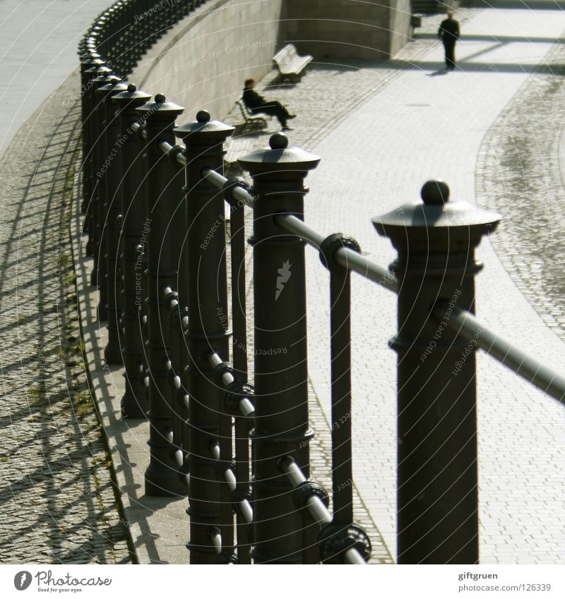 lunch break Lunch hour Fence Relaxation Midday sun To go for a walk Pedestrian Detail Success Man Shadow Sit Sun Bench