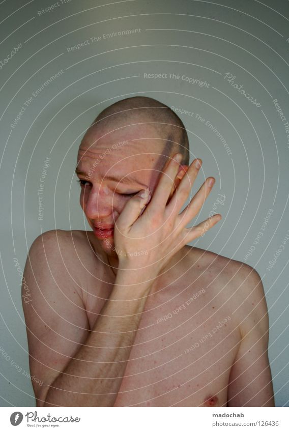 Young man is sad and cries because he is sensitive and bald and he is naked and defenseless Authentic Life Really Portrait photograph Gesture Heartrending