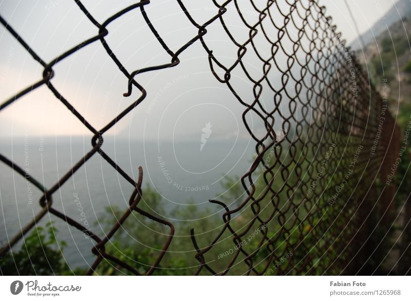 fence Far-off places Freedom Ocean Island Success Loser Clouds Storm clouds Bad weather Mountain Coast Lakeside Bay Metal Rust Water Broken Protection Hope