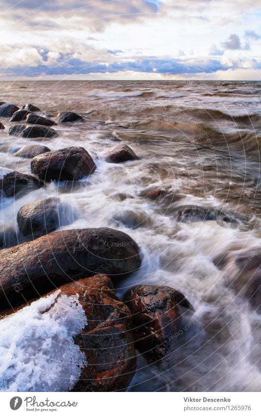 Stones and snow storm with waves Beautiful Vacation & Travel Beach Ocean Island Winter Snow Environment Nature Landscape Sky Clouds Climate Weather Storm Rock