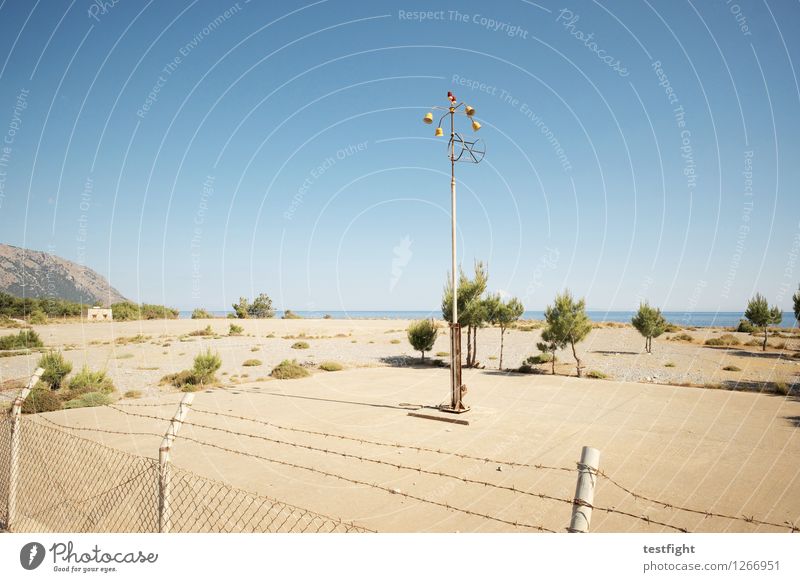 square Landscape Sky Sunlight Plant Tree Coast Ocean Island Outskirts Deserted Places Manmade structures Esthetic Lantern Lighting Fence Concrete Colour photo