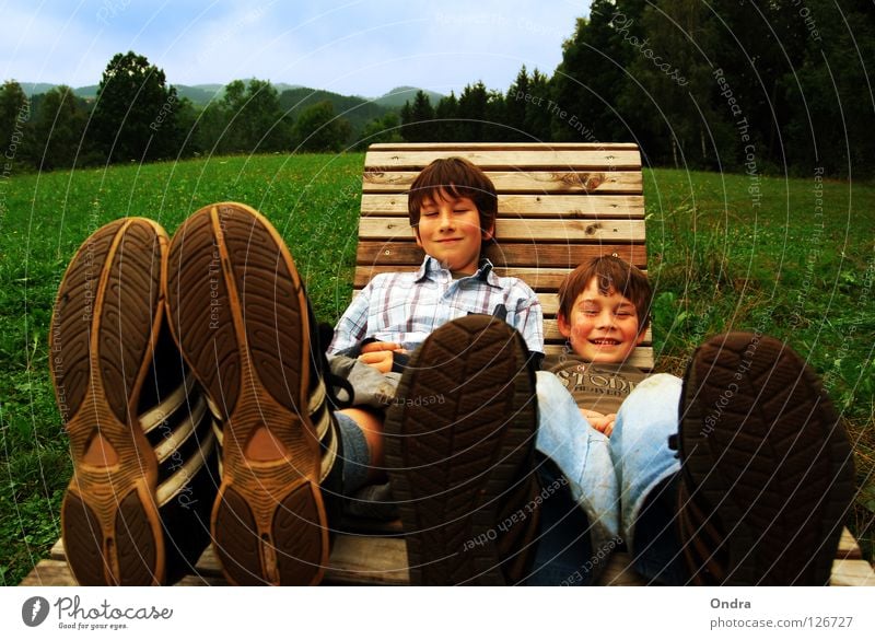 Life on big feet Clouds Meadow Child Boy (child) Masculine Tree Forest Green Environment Footwear Shoe sole Rocking chair Deckchair Happiness Summer Joy Sky