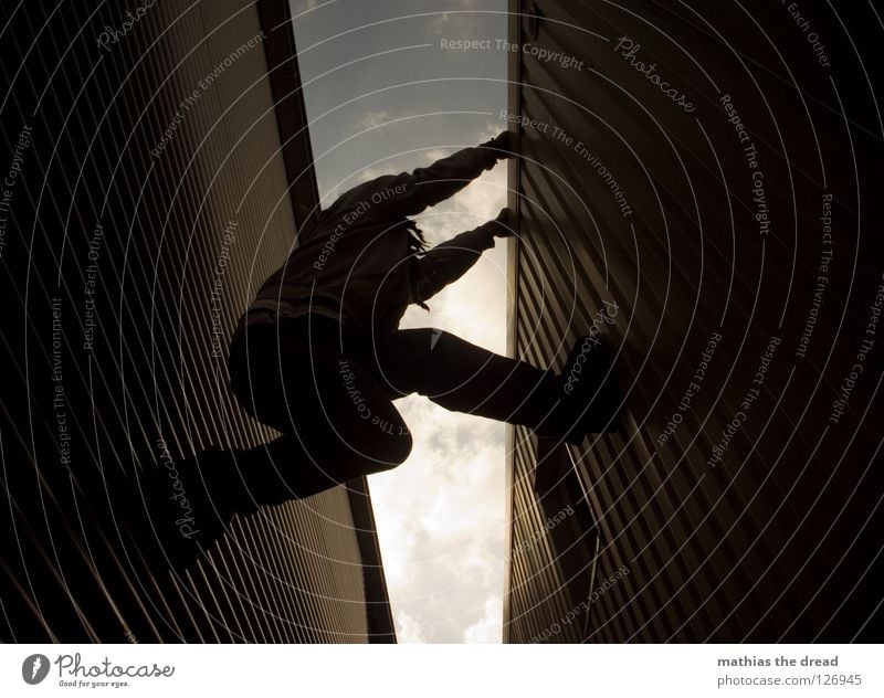 ALMOST! Part 3 Wall (building) Facade Tin Waves Corrugated sheet iron Window Worm's-eye view Climbing Break Effort Clouds Alley Parallel Man Dark Cold Dangerous