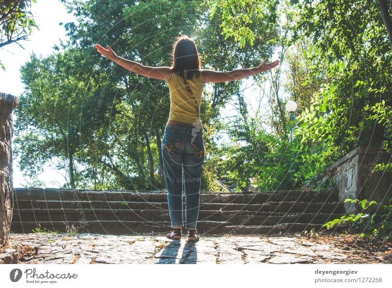 Woman with arms outstretched against sun Lifestyle Joy Happy Beautiful Relaxation Leisure and hobbies Freedom Summer Sun Girl Adults Arm Nature Sky Stand