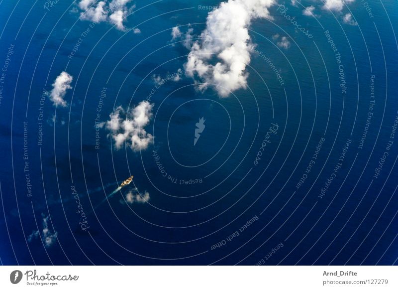 Small ship Watercraft Clouds Aerial photograph Ocean Vantage point Bird's-eye view Waves Loneliness Air Airy Cargo-ship Lake Sea route Navigation Sporting event