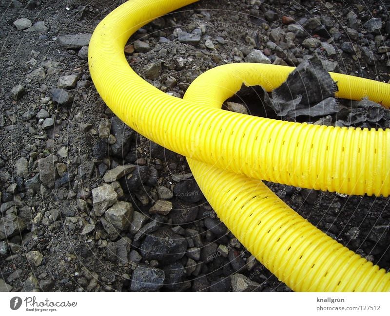 loop Yellow Gray Hose Furrow Curved Muddled Traffic infrastructure Industry Roller coaster Stone Statue Plastic Gravel