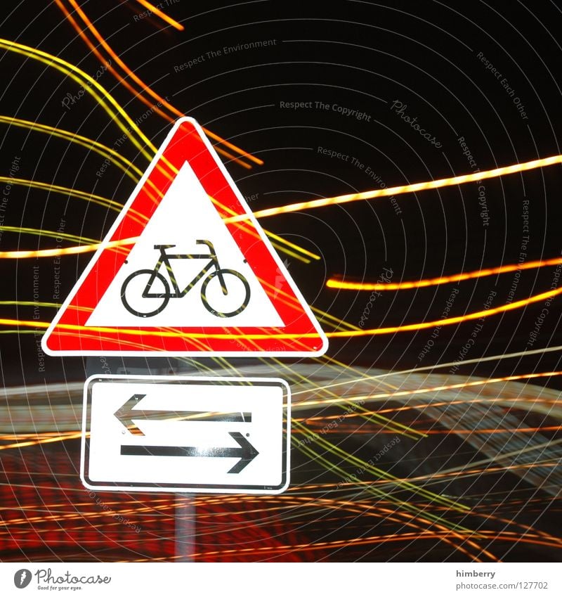 bikers crossing Lamp City life Lightning Zoom effect Exposure Long exposure Night Street sign Bicycle Stripe Transport Road traffic Urban traffic regulations