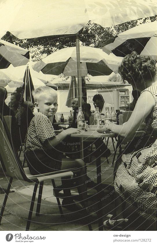 50ies - MAMA'S LIEBLING Sixties Historic Black & white photo Sidewalk café Beach café Looking into the camera Boy (child) 3 - 8 years Mother Young woman Summer