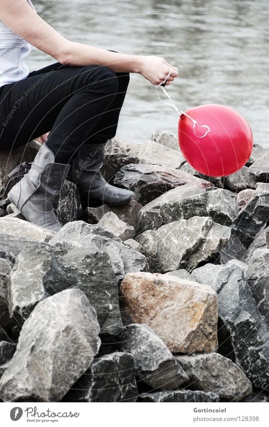 On the Rhine Human being Young woman Youth (Young adults) Woman Adults Arm Hand Legs Feet Nature River bank Pants Footwear Boots Balloon Think Sit Playing Dream