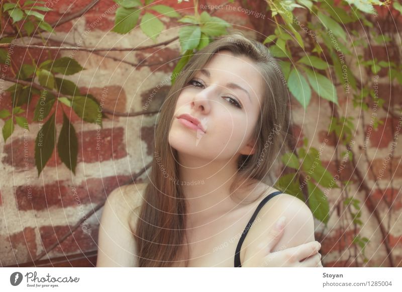 Beautiful young woman with hot eyes in front of a brick wall Young woman Youth (Young adults) 1 Human being 18 - 30 years Adults Dancer Belly dance Garden Sofia