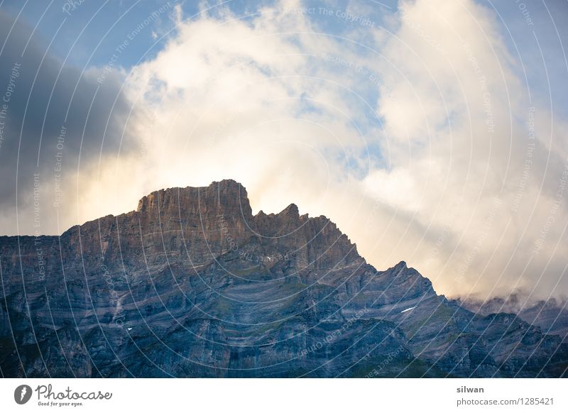 "El Capitan? Landscape Sky Clouds Storm clouds Summer Beautiful weather Rock Alps Mountain Peak Freeze Exceptional Gigantic Large Thorny Blue Gray Orange White