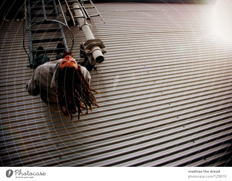 Just let it dangle! Wall (building) Facade Tin Waves Corrugated sheet iron Window Worm's-eye view Climbing Break Effort Clouds Alley Parallel Man Dark Cold