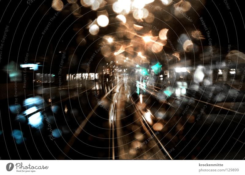 In the last tram Tram Transport Railroad tracks Drops of water Night Switzerland Town Night life Way out Late Dark Rain Wet Public transit ov Window pane Glass