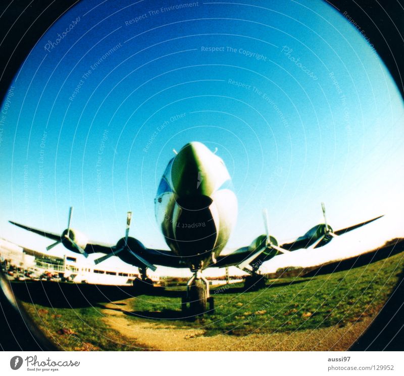 BLINDED BY THE FLIGHT Airplane Captain Engines Wing Airplane takeoff Fisheye Round Lomography Aviation Jet Airplane landing Sky kerosene Climate change