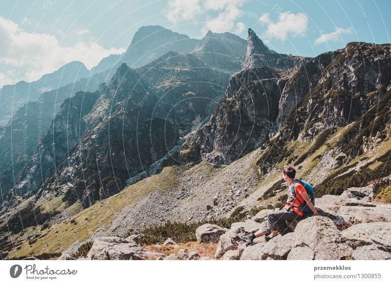 Boy resting on a rock in the Tatra Mountains Lifestyle Vacation & Travel Trip Adventure Freedom Summer Hiking Boy (child) 13 - 18 years Youth (Young adults)