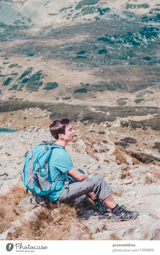 Boy resting on a mountain trail Lifestyle Vacation & Travel Trip Adventure Freedom Summer Summer vacation Mountain Hiking Boy (child) 1 Human being