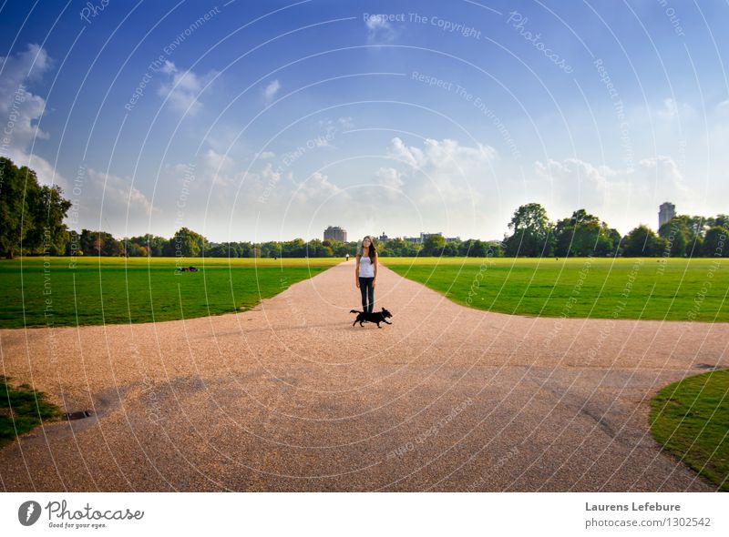 Young woman standing in a London park. Vacation & Travel Tourism City trip Human being Youth (Young adults) 1 18 - 30 years Adults Landscape Sky Clouds Summer