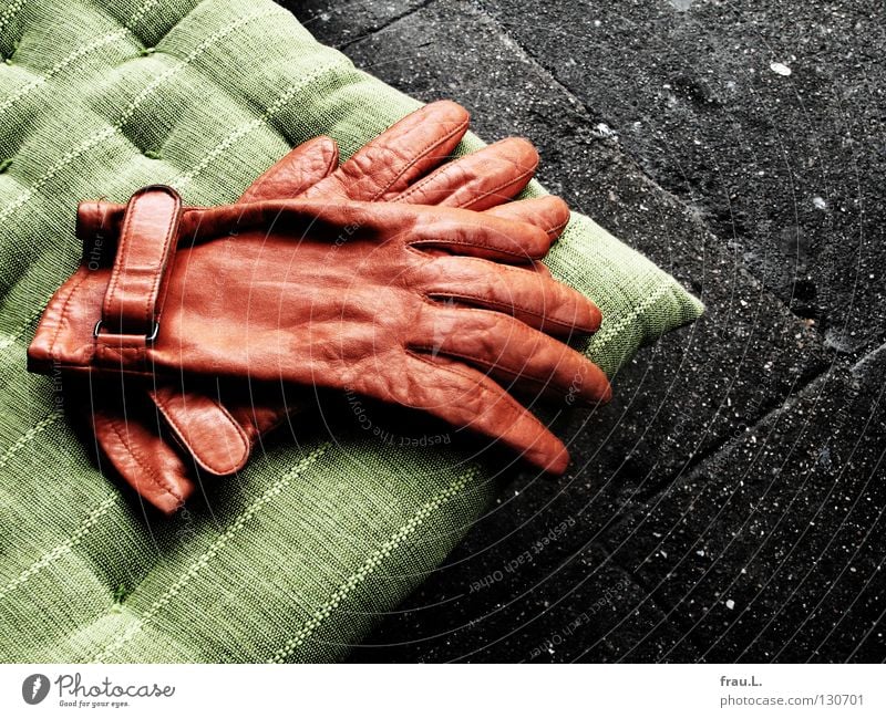 discarded Gloves Cushion Green Leather Cloth Sidewalk Concrete Sidewalk café Remote Comfortable Physics Posture Clothing Traffic infrastructure Orange