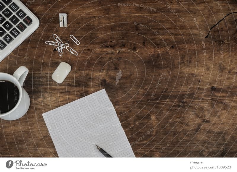 White paper, pen, paper clips, eraser, calculator and a cup of coffee on an old wooden desk Beverage Coffee Cup Desk Work and employment Profession Office work