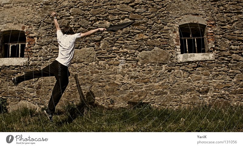 trick Jump Umbrella Man T-shirt White Black Brown Stony Wall (building) Wall (barrier) Stone wall Plaster Drop shadow Happiness Cheerful