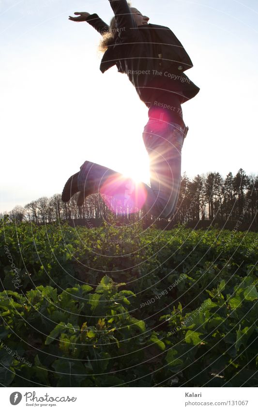 flight Woman Cold Dark Field Green Cabbage Jump Ease Evening sun Exterior shot Back-light Sunset Joy Spring Sky Clarity Blue Free Flying Freedom To enjoy Life