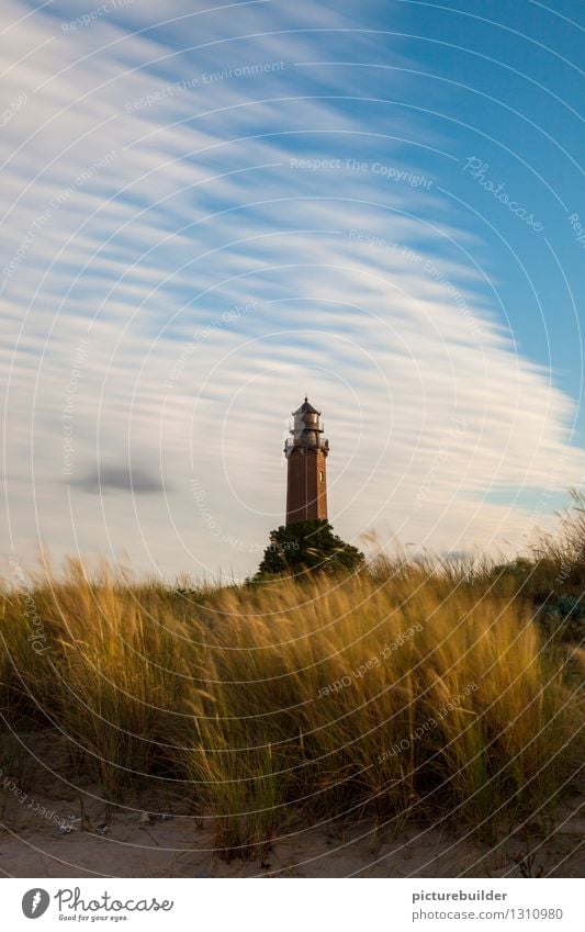 Lighthouse in the evening light Tourism Summer Beach Coast Baltic Sea Ocean Deserted Road sign Blue Gold Hope Trust Colour photo Exterior shot Copy Space top