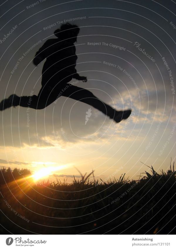 Jump over the sun Man Sunbeam Light Dark Meadow Clouds Sunset Playing Sky Human being Lighting Lamp Shadow Contrast Evening Legs Arm Feet