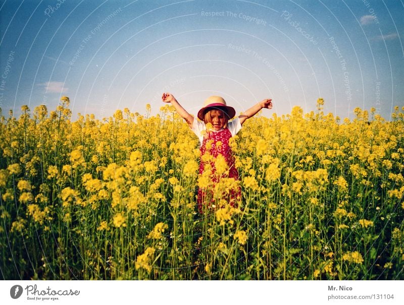 Statue of Liberty girl Child Toddler Blonde Straw hat Nursery school child Canola Yellow Canola field Dress Summer Sun Summer dress Jumper Pattern Outstretched