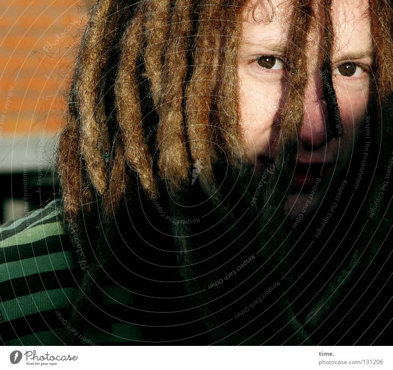 Johan Pablo, musician Penumbra Light Dreadlocks Hair and hairstyles Multiple Hoop stripe t-shirt Evening sun Friendliness Man Detail Beautiful Looking Face Eyes