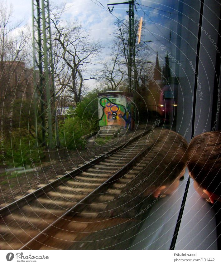 on tracks back to everyday life... Railroad Train travel Railroad tracks Green Clouds Bad weather House (Residential Structure) Building Child Fatigue Curiosity