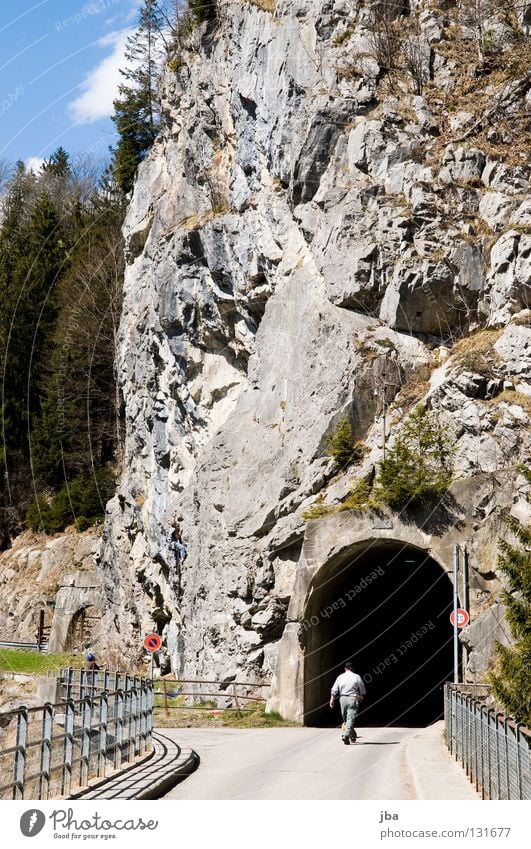 climbing rocks Tunnel Dark Passage Tar Mountaineer Rescue Man Going Ambiguous Fir tree Forest Steep Rock Bridge Handrail Stone Climbing Task Joy