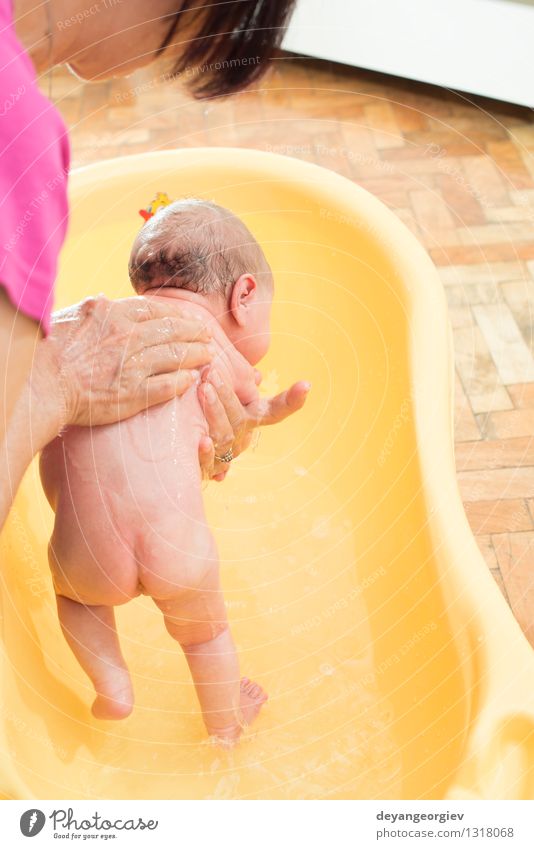 Bathing newborn baby girl. Happy Beautiful Skin Face Bathtub Bathroom Child Human being Baby Girl Boy (child) Infancy Small Wet New Cute Clean White Newborn