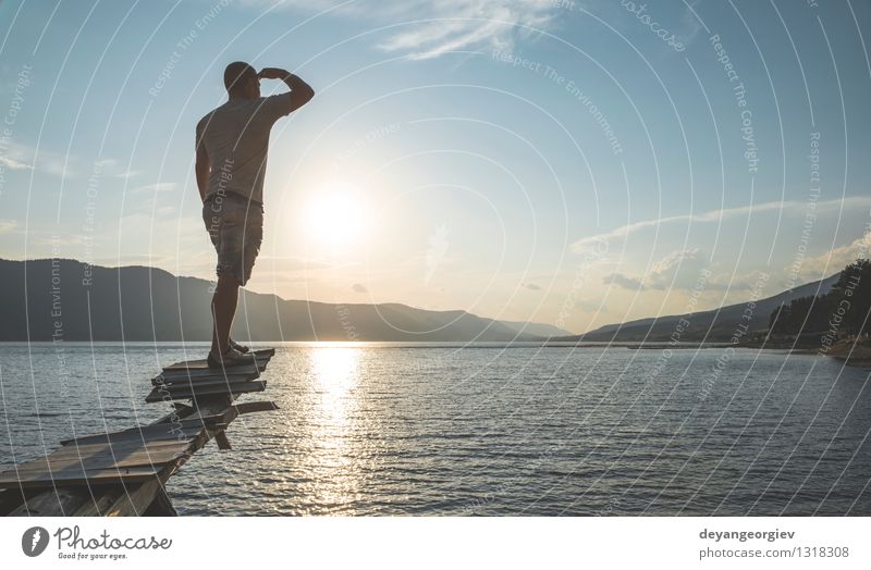 Young adult in front of mountain lake Lifestyle Happy Beautiful Relaxation Leisure and hobbies Vacation & Travel Tourism Adventure Camping Summer Mountain