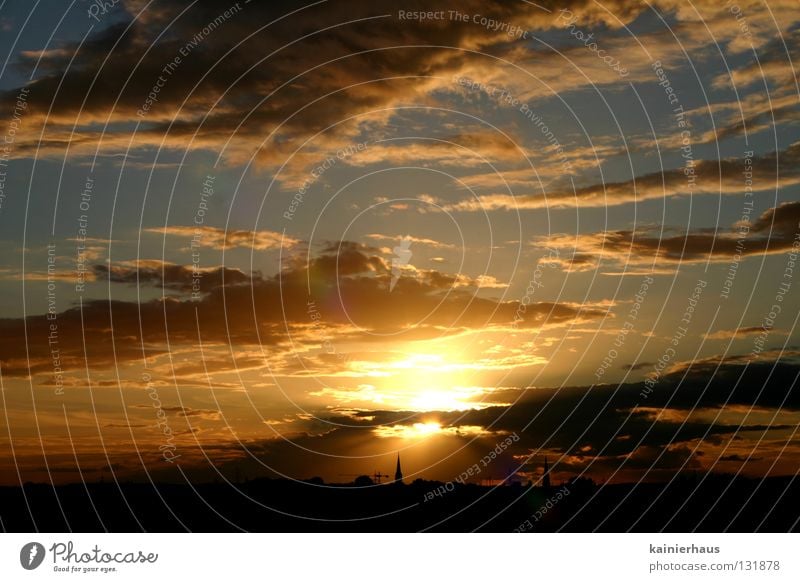 Contrast in Light Clouds Church spire Horizon Celestial bodies and the universe Sun Sky Religion and faith Blue