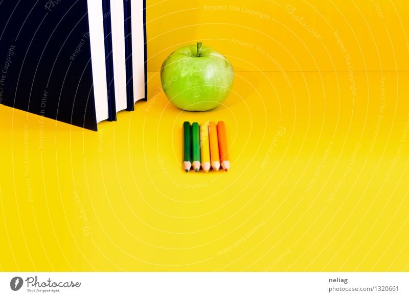 Books, green apple, colored crayons on bright yellow background Food Fruit Apple Reading Education School Study Blackboard Schoolchild Student Teacher