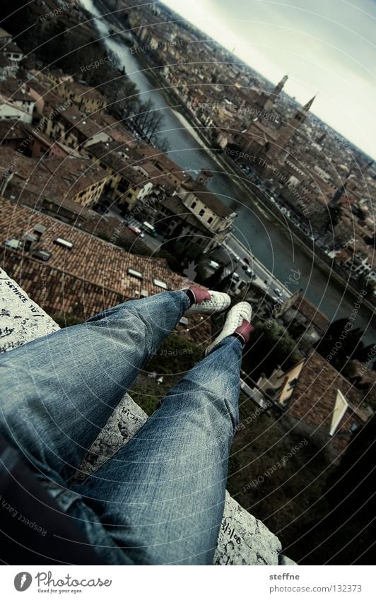 ski flying Footwear Thigh Pants Town Verona Italy Historic Adige Horizon Dangerous Stuntman Edge Cliff Church spire Roof Dramatic Danger of Life Man Lie Legs