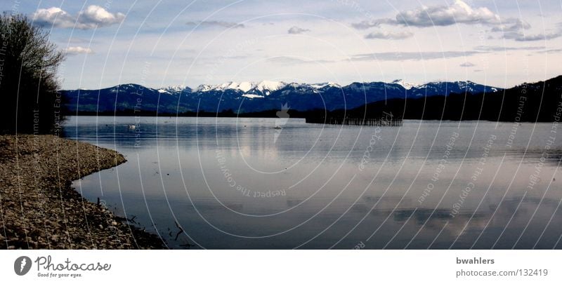 almost like Canada Lake Clouds Tree Beach Peak Far-off places Calm Surface of water Peace Reflection Mountain Sky Coast Stone Water Snow Alps Blue Pole