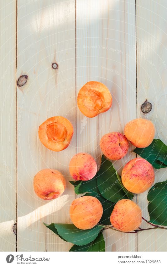 Fresh apricots straight from the garden on wooden table Food Fruit Summer Table Nature Leaf Delicious Natural Juicy Yellow Green Orange Apricot healthy Organic