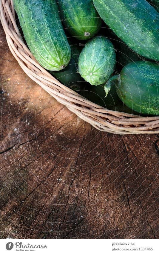 Cucumbers in the wicker basket Vegetable Summer Garden Fresh Natural Green Basket Copy Space cucumber food healthy Organic Rustic Seasons Vertical wood wooden