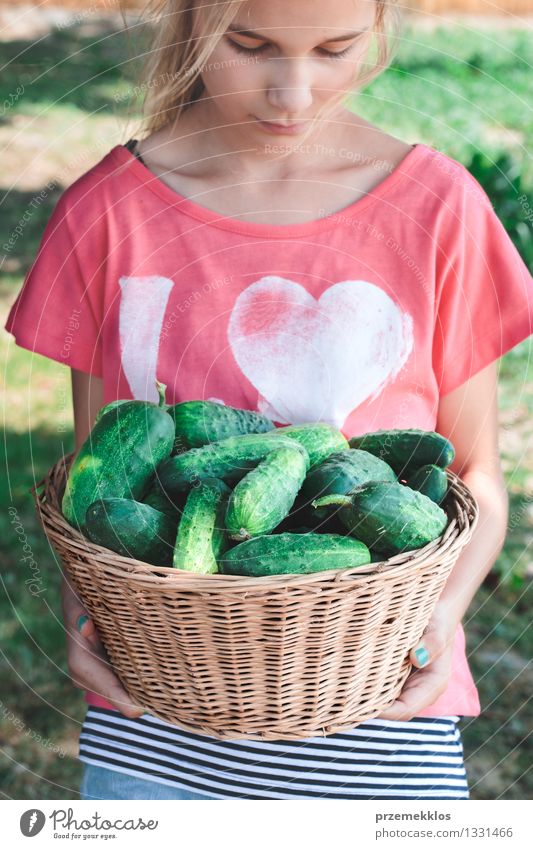 Girl carrying wicker basket with cucumbers Vegetable Lifestyle Summer Garden Human being 1 8 - 13 years Child Infancy Nature Fresh Natural Green Effort Basket